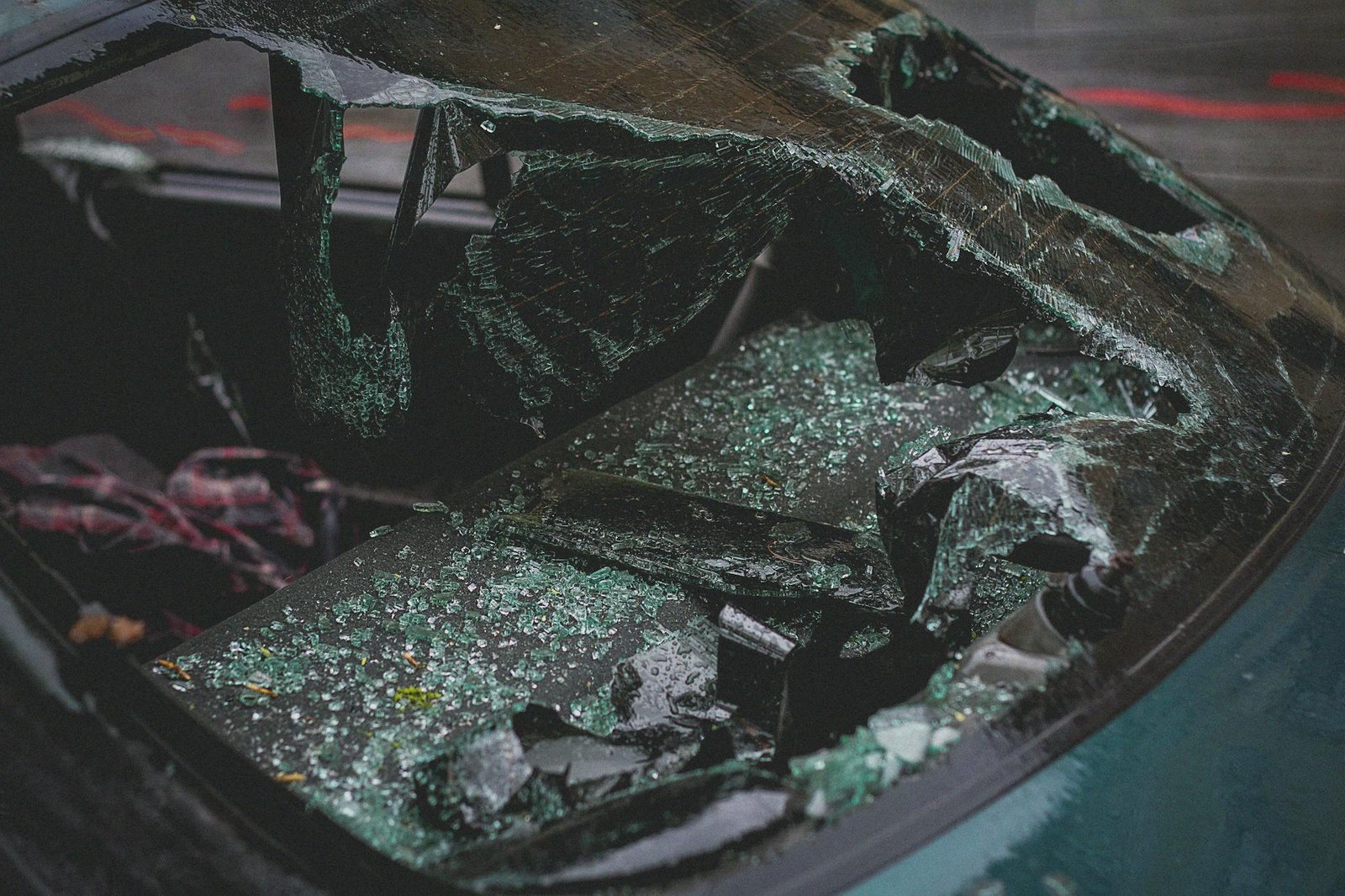 Close-up of vehicle damage after an accident (broken windshield)
