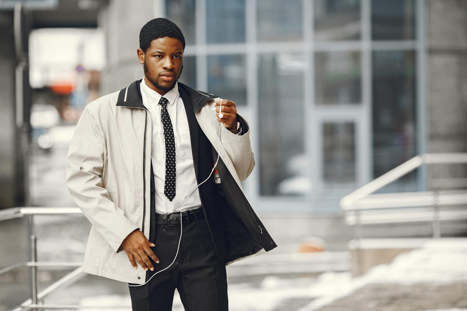 Person holding earphones for a phone call